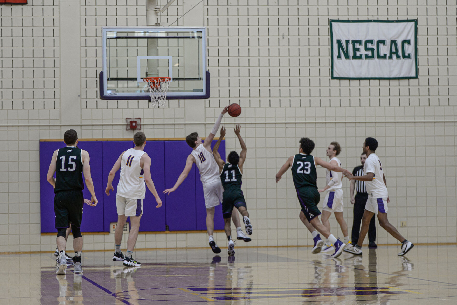 Williams' Nate Karren blocks a shot attempt by Amherst's Grant Robinson